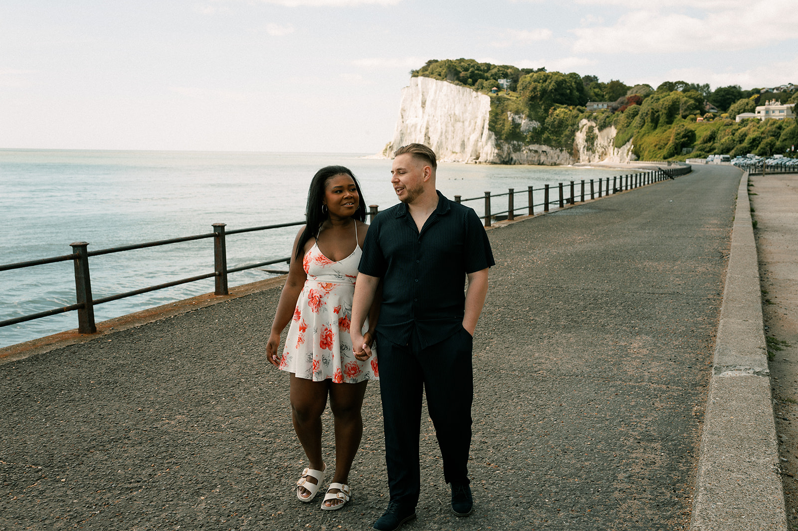 Strolling along the promenade with the white cliffs behind