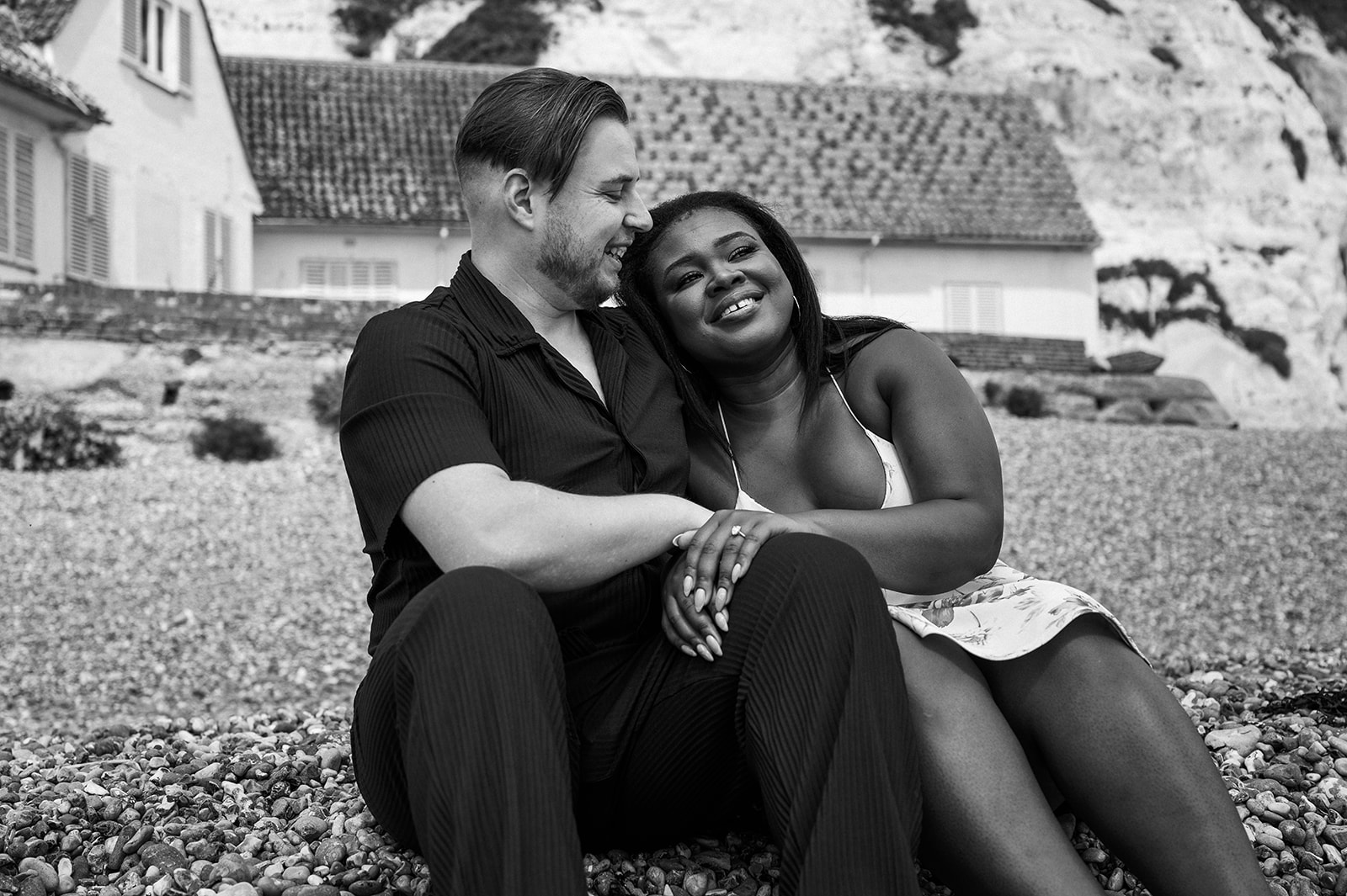 Sitting together on the beach, laughing