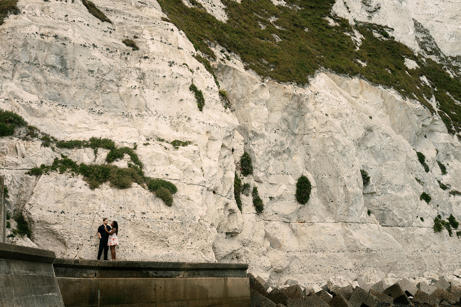 Stephanie and Teodor overlooking the sea on a dramatic cliff